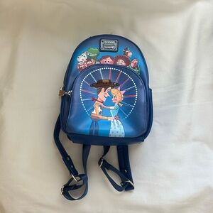 LOUNGEFLY PIXAR MOMEMT TOY STORY WOODY, BO PEEP, & TOYS BACKPACK